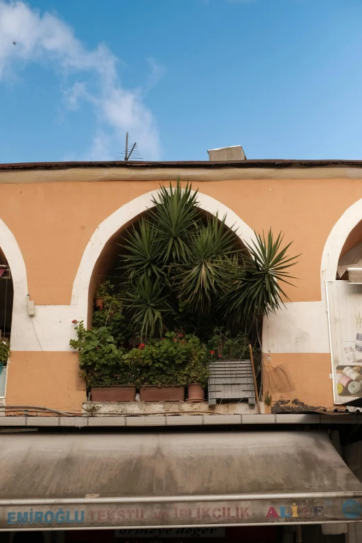 an old building with arches in front of the front door