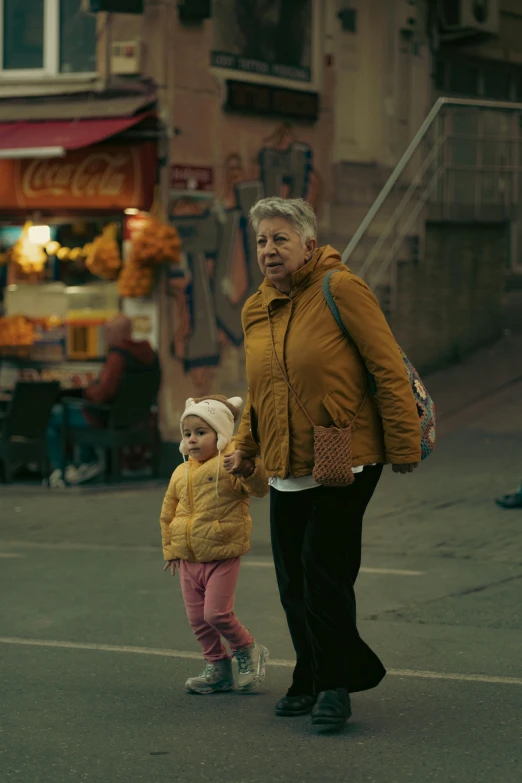 the old woman and the small girl are walking together