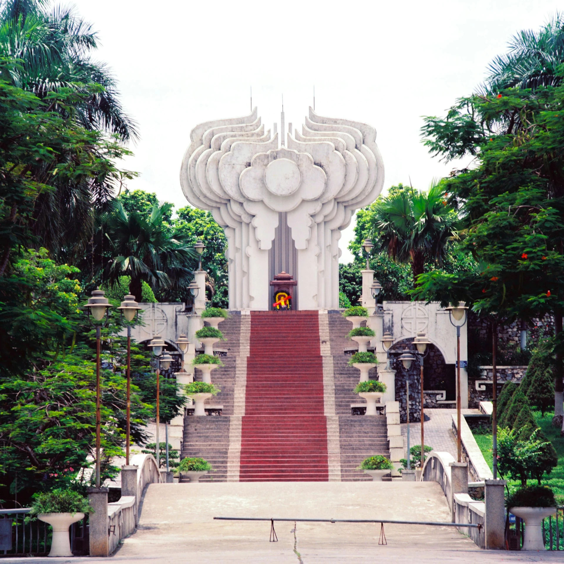 an art deco building in the middle of some trees