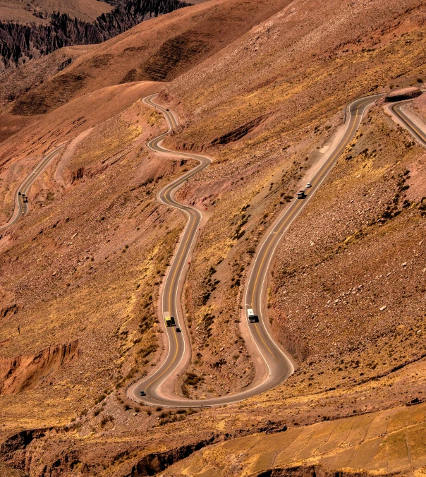 three curves in a mountain pass on a winding road