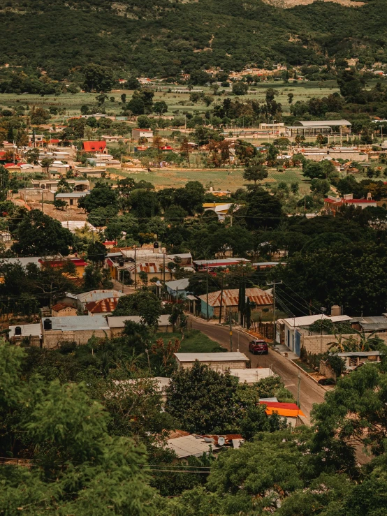 a town surrounded by trees and hills