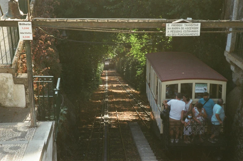the trolley cars leave its stop on the tracks