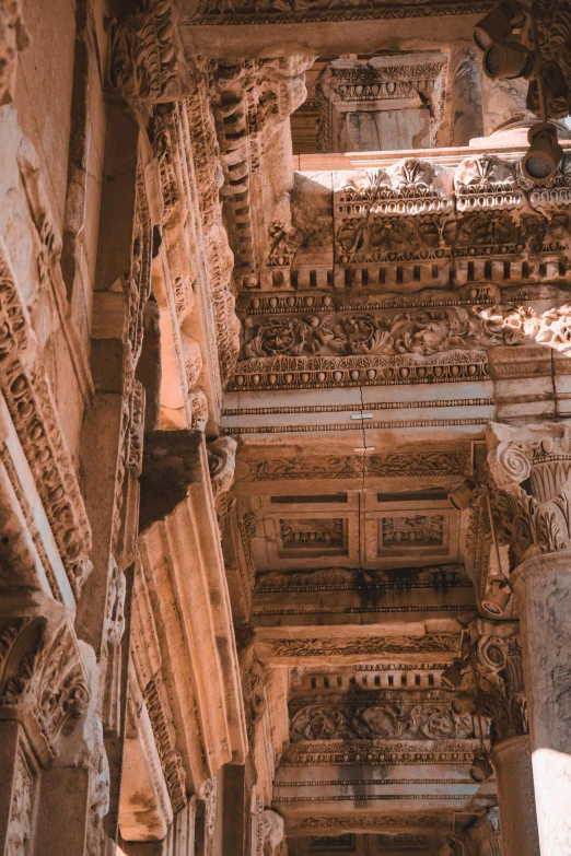 a stone structure with decorative carved designs and columns