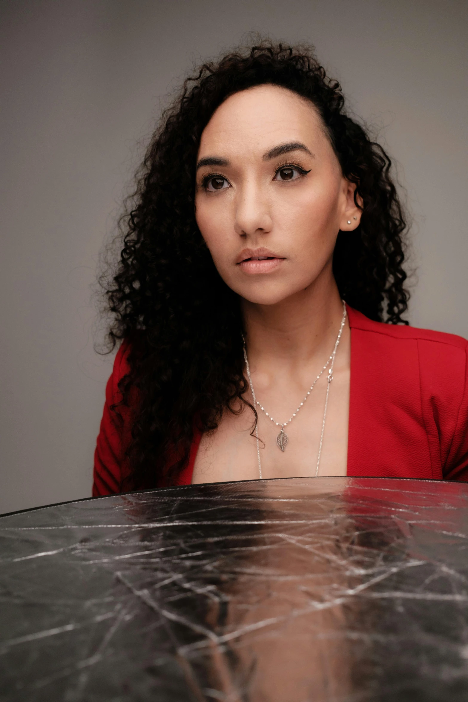 woman posing for a po with very large curly hair