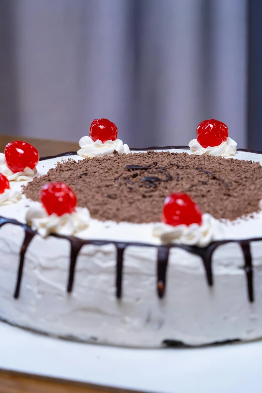 a dessert cake that is covered in white frosting