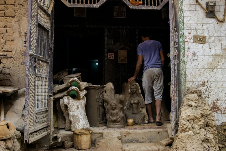 a man climbing up the stairs of an unfinished building