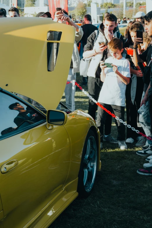 the car is on display at an automobile show