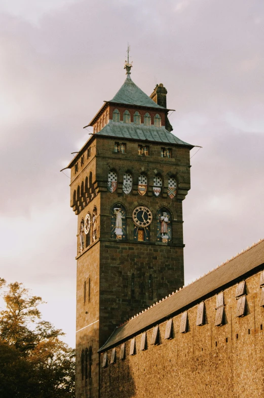 a brick tower that has clock at the top