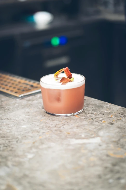 an alcohol glass sitting on top of a counter