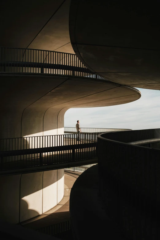 a building and staircase with a person in front