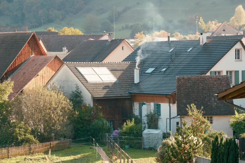 several houses in the city with their roofs covered