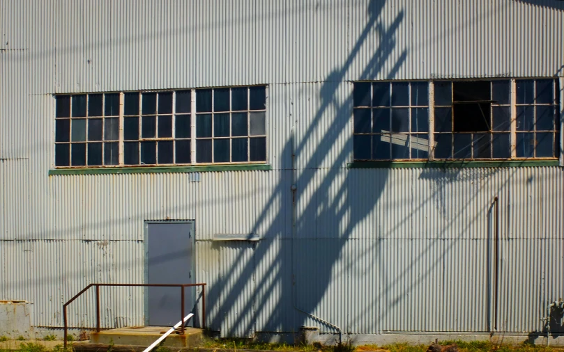 a white fire hydrant sitting next to a building