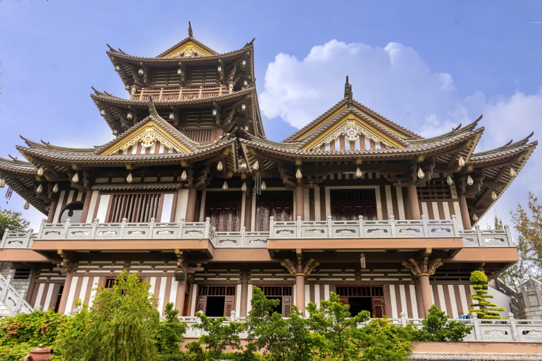 an ornate building is pictured against the blue sky