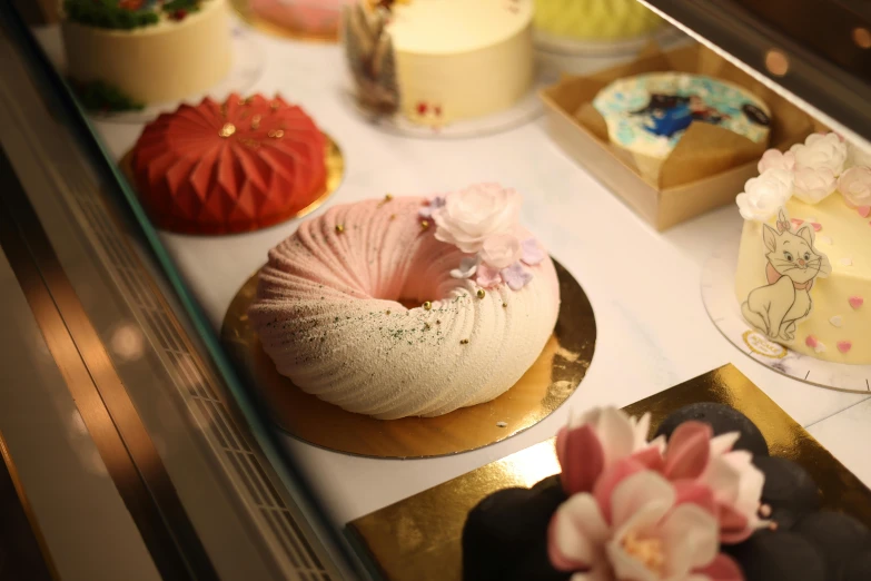 a display of different types of cakes on display