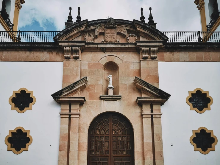 the building has two doors that lead out to a bell