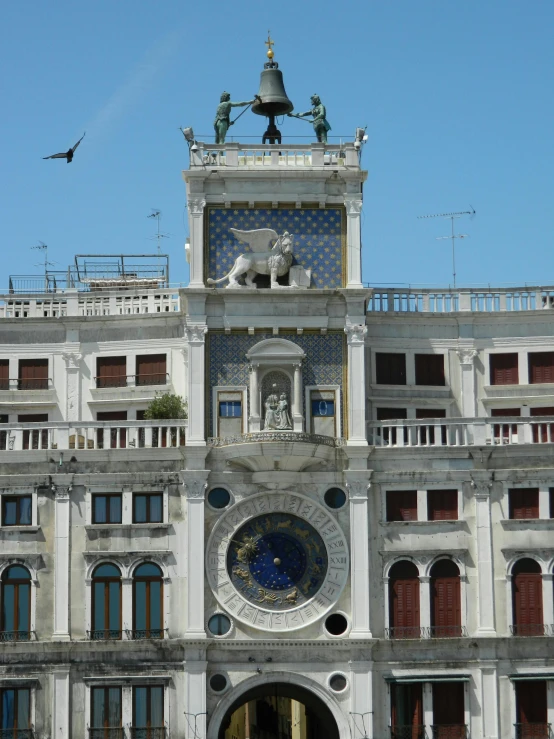 a large building has a clock tower on top of it