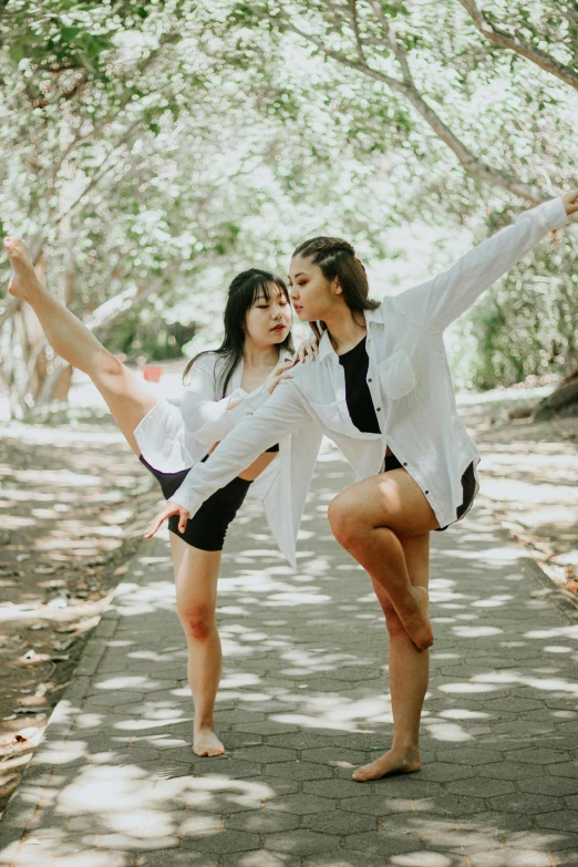 two young women pose for the camera as they are kissing