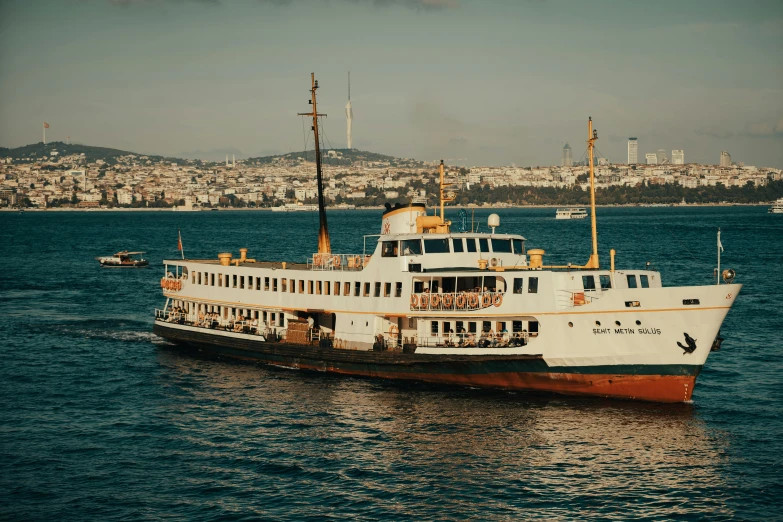 an old passenger ferry sailing across a body of water