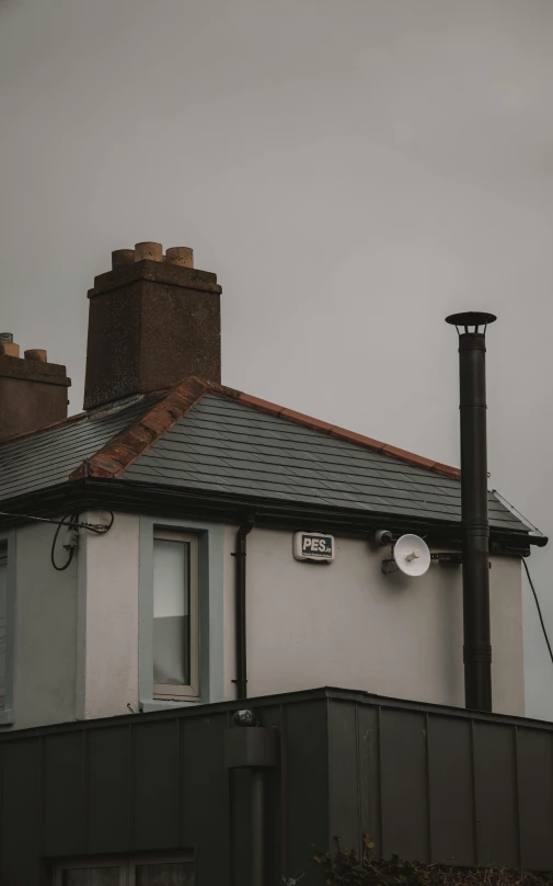 a home with a clock on the side of it