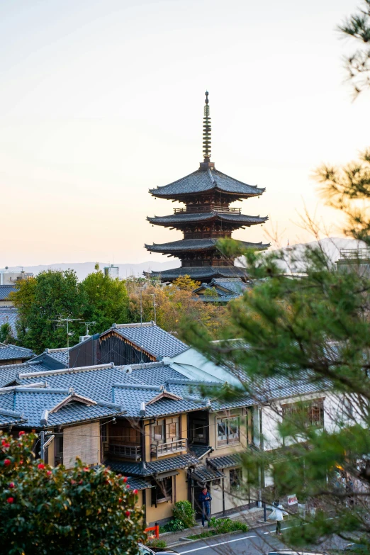 the pagoda tower has a blue tiled roof