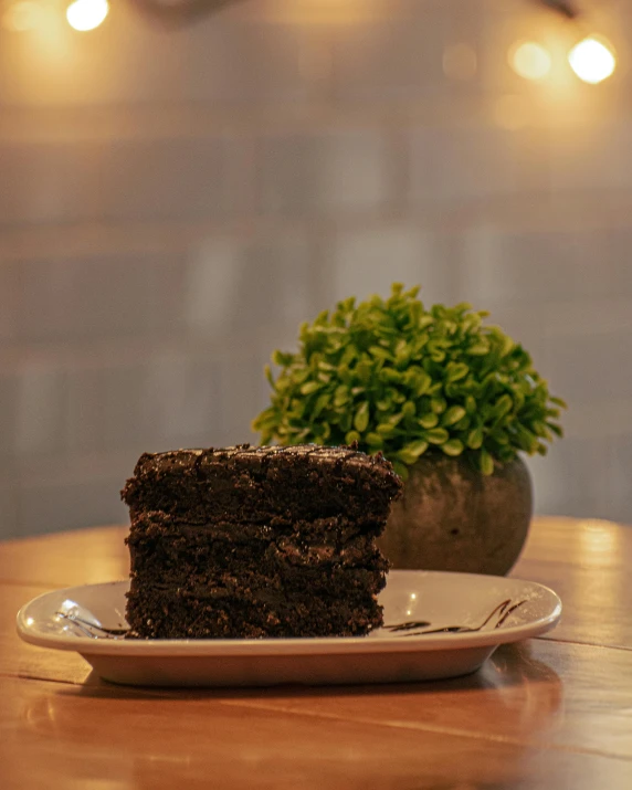 a chocolate cake with brown sugar on it on a table