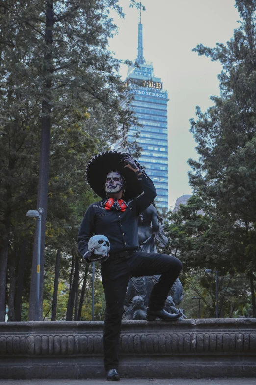 a man in a costume and sombrero doing a trick