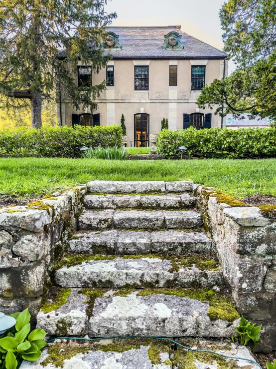 a building sitting behind some very pretty stone steps