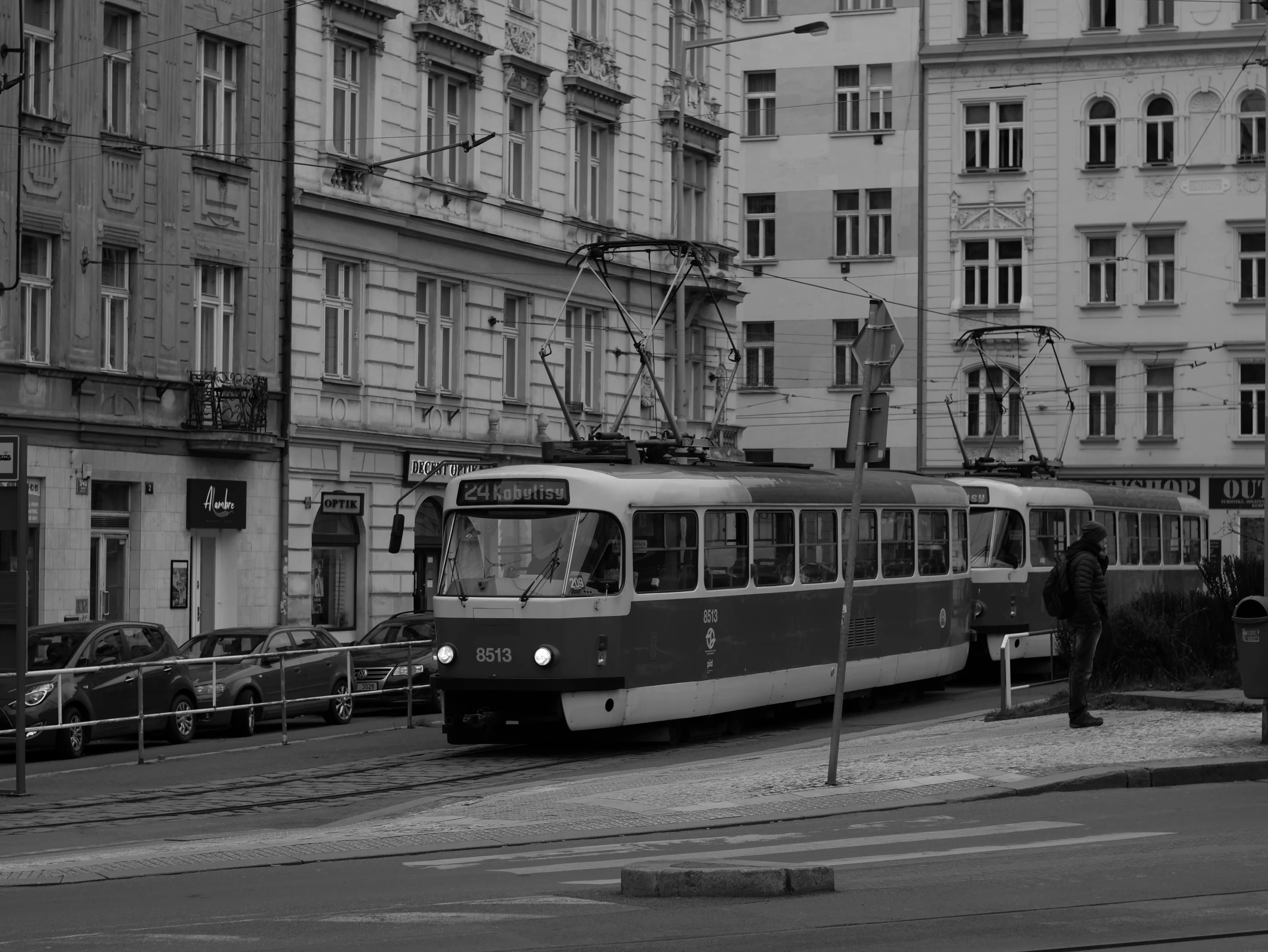 a train is moving on the track through some buildings