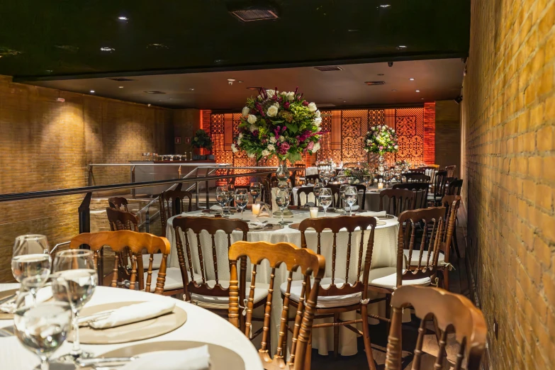 a large white table with white clothed tables and chairs