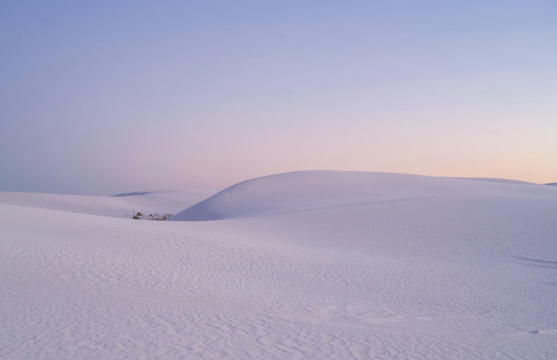 a skier is making his way down a very big hill