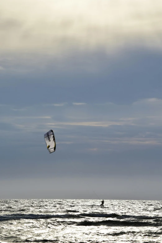 a para sail surfing on a calm day on the ocean