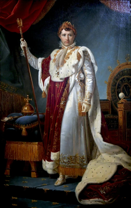 a man in fancy clothing with a crown