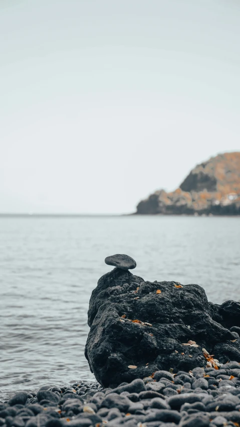 there is an image of rock formation on the shore