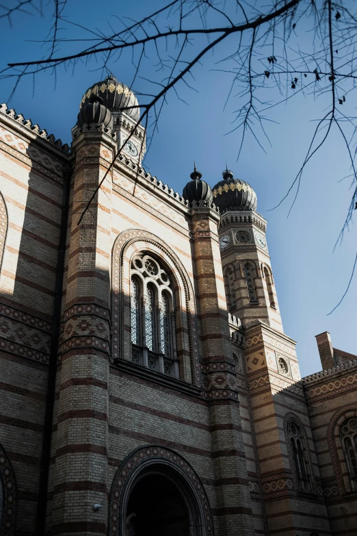 a large building with two towers that have turrets