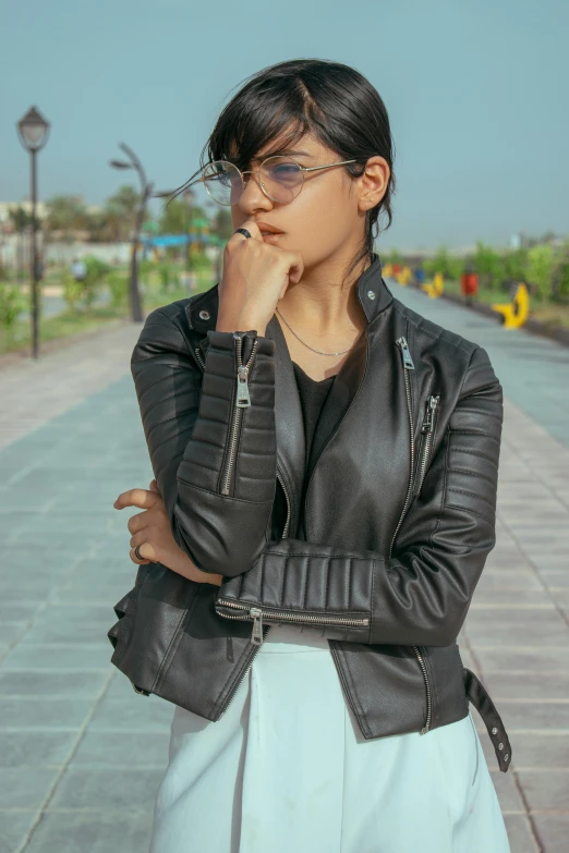 a woman posing with her hand on her chin