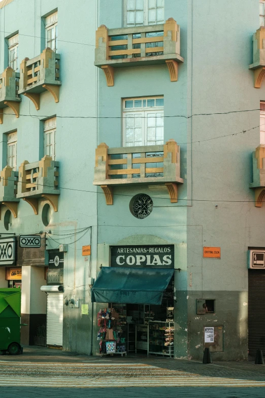 some windows above a store on a street corner