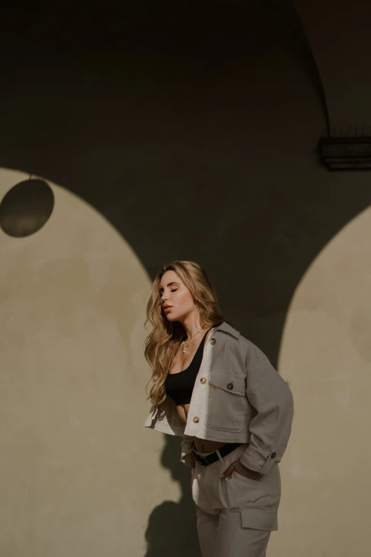 a women standing in front of a wall