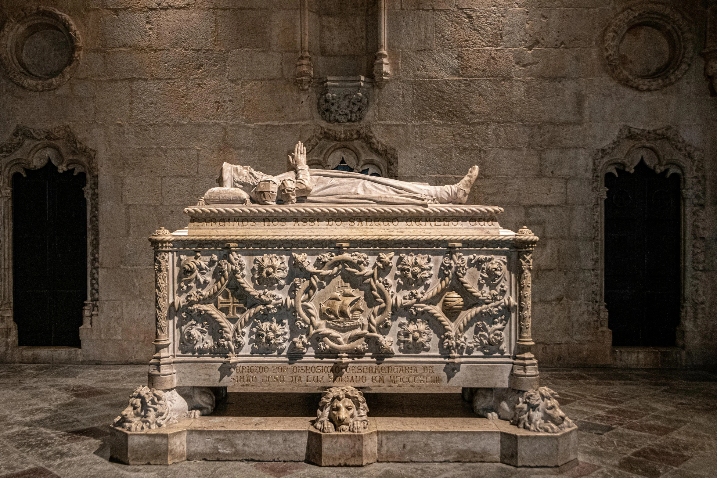 a statue sitting on top of a wooden table