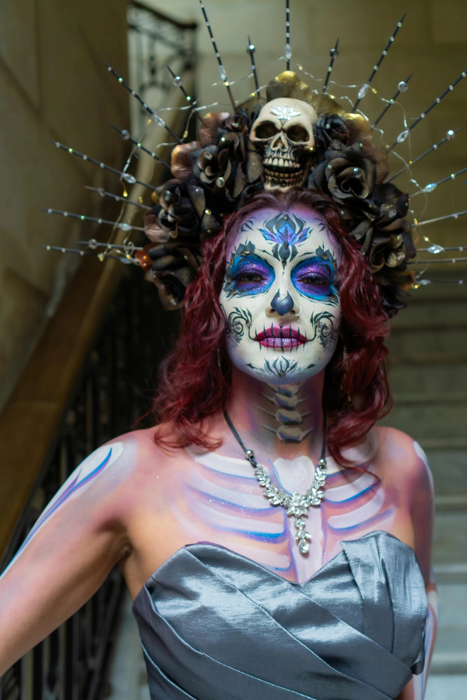 a woman in makeup with skull on her head