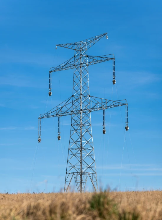 a tall power line sitting in the middle of nowhere