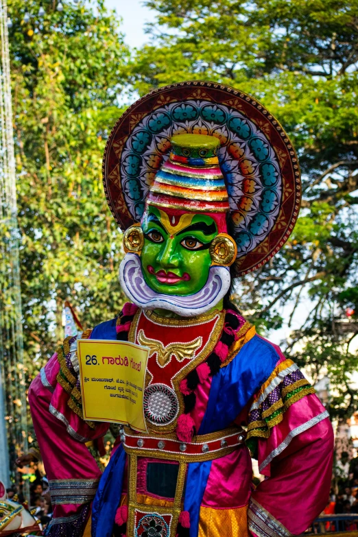 an elaborate face painted costume is displayed