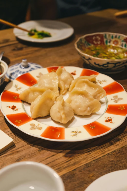 some food on a plate with chop sticks