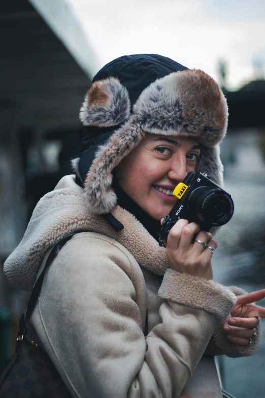 a woman is taking a picture with a camera