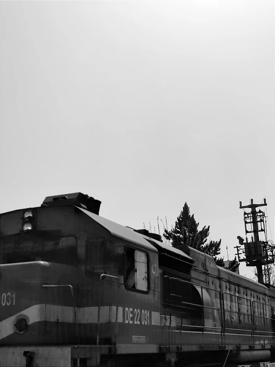 a black and white po of a train traveling by