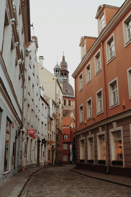 the view from a narrow street in a city