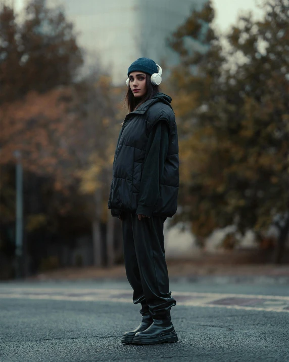 a young person stands on the street