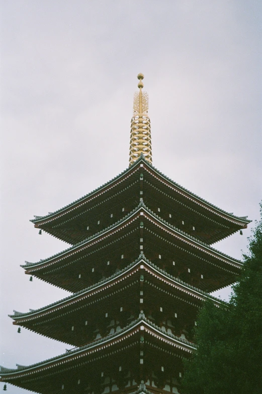 a tall chinese building is in the background