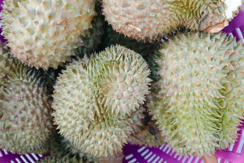 some fruit sitting in a purple container