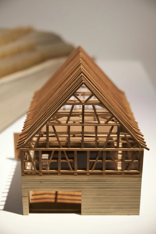 a small model wooden house made out of wood
