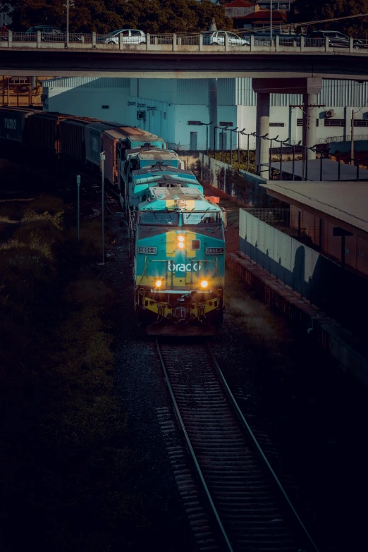 a train engine with three carts on the track